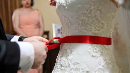 В чем смысл красной ленты? Почему красный пояс привязан к невесте?